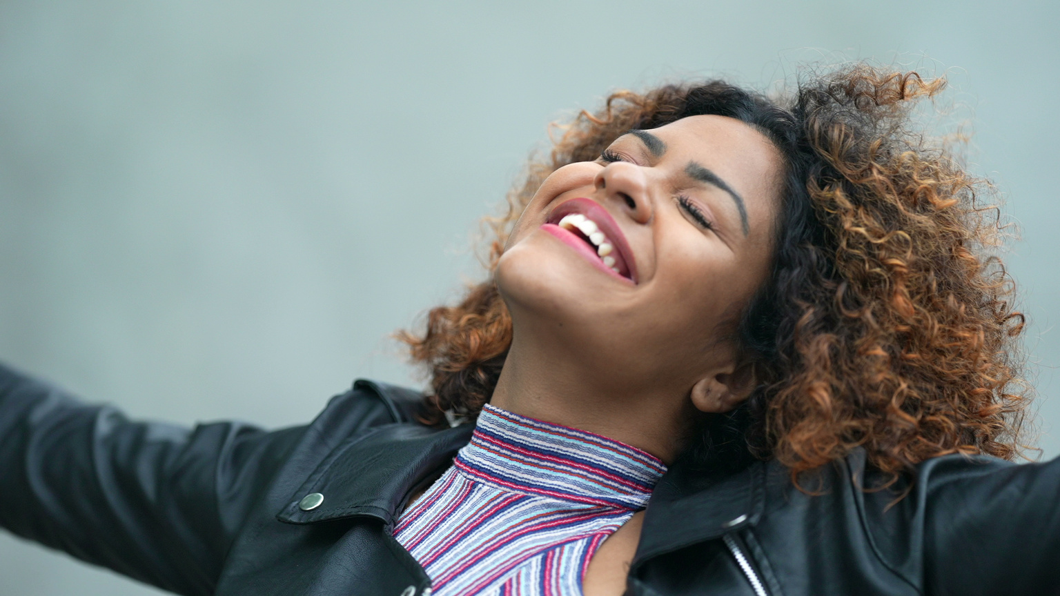 Carefree black woman portrait smiling feeling free