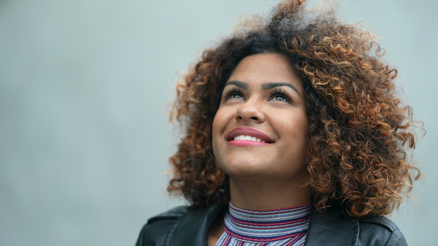 Carefree black woman portrait smiling feeling free